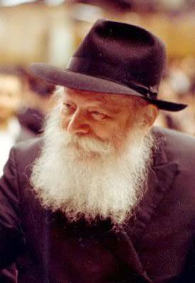 The Lubavitcher Rebbe — color portrait Color portrait of the smiling Lubavitcher Rebbe in a black hat with a long white beard